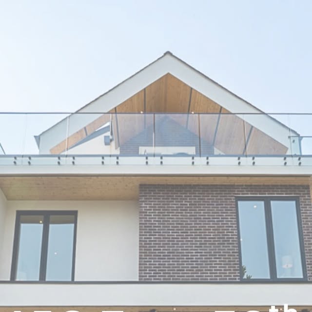 456 East 38th duplex, with timber-clad gable, brick facade and glass railing